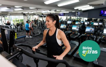 Image of a woman walking on a treadmill